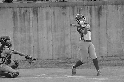Bowlegs Lady Bison Cira Parsons knocks one to the outfield to get on base. Staff Photo by Bill Anderson
