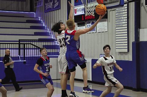 Butner Eagle Roque Bethany hook shots the ball for the basket Thursday evening at Bowlegs. Staff Photo by Bill Anderson