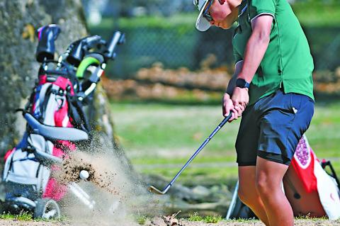 Seminole Chieftain Tre Hasbell uses a wedge to get out of a trap in the tournament. Courtesy Photo by Brian Blansett