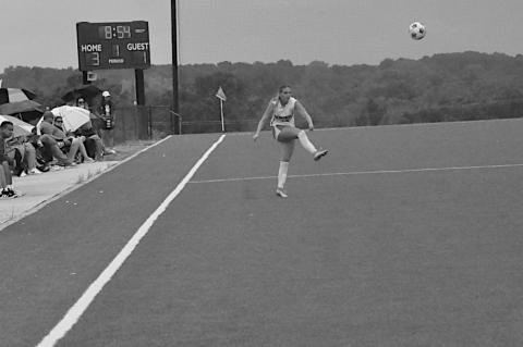 Seminole State Lady Trojan Emma Fanous kicks the ball back into play Sunday. Staff Photo by Bill Anderson
