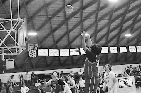 Bowlegs Bison Kingston Burgess shoots the fade Monday night Staff Photo by Bill Anderson