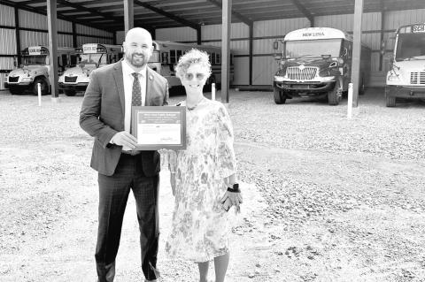 U.S. Department of Agriculture Rural Development Oklahoma State Director Zachary Swartz presents a $50,000 grant award to Rhonda Barkhimer, Superintendent of New Lima Public Schools. The grant, part of a $4.2 million investment in rural Southeast Oklahoma