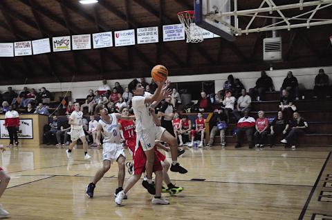 New Lima Falcon Angel Clark finds an opening and goes up for the shot Thursday night at home. Staff Photo by Bill Anderson